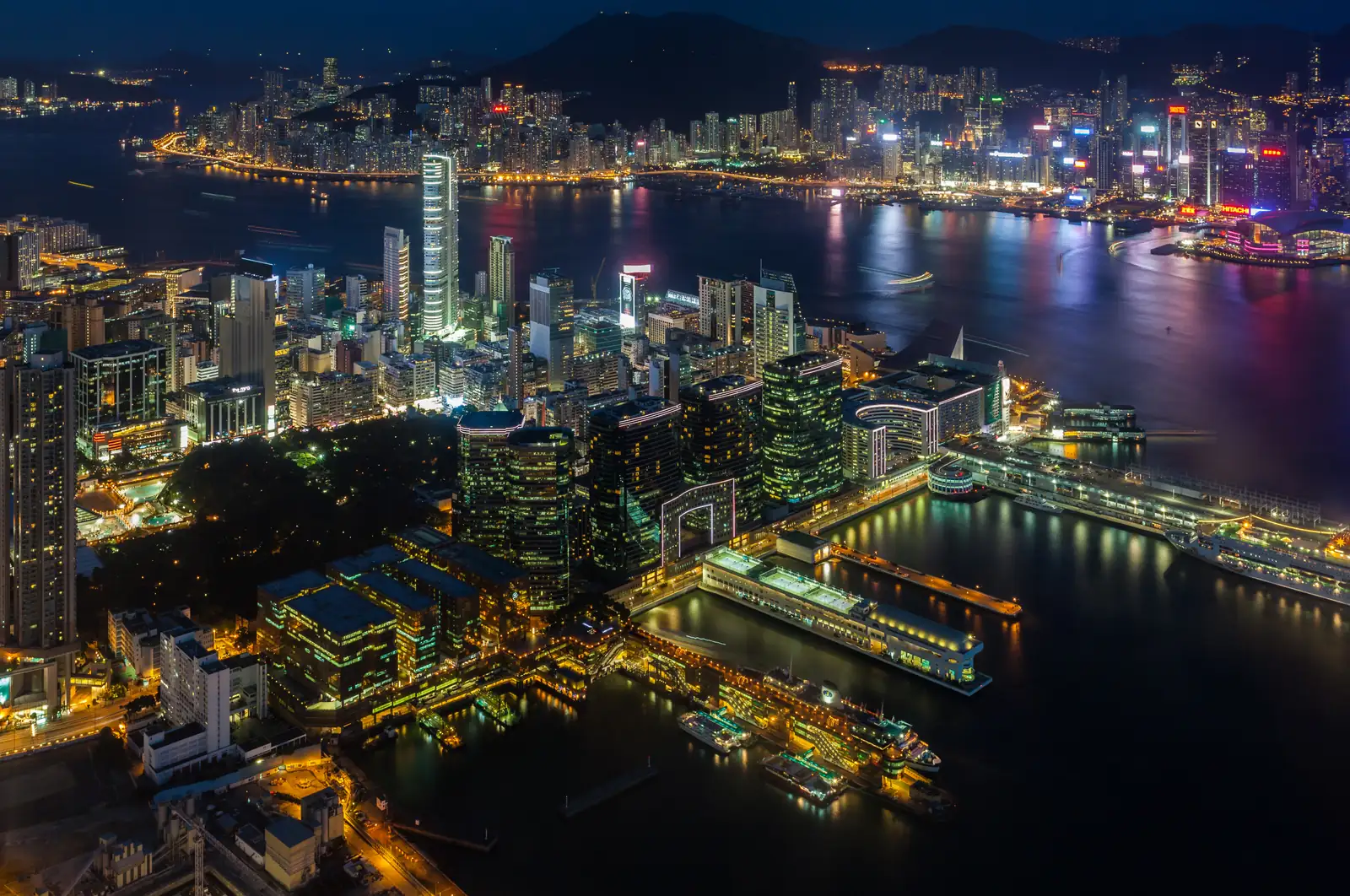 Hong Kong at night across Victoria Harbour: non-Chinese permanent residents lose the right of abode after 36 months of continuous absence